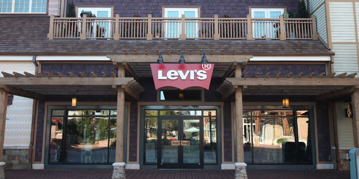 Levi’s store front with glass doors featuring custom door handles