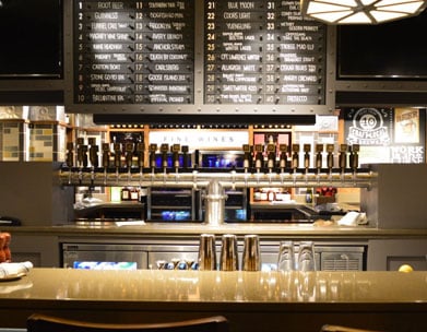 Office Tavern bar featuring many tap handles
